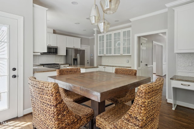 5809 N Hawthorne Way, Raleigh, NC 27603 - dining area with crown molding and dark wood-style floors