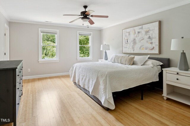 5809 N Hawthorne Way, Raleigh, NC 27603 - bedroom with light wood finished floors, ornamental molding, and a ceiling fan
