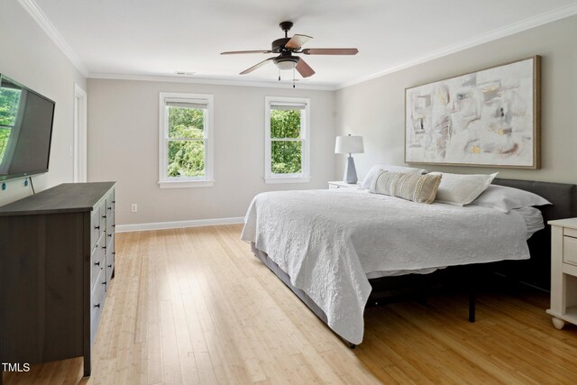 5809 N Hawthorne Way, Raleigh, NC 27603 - bedroom with light wood-style flooring, ornamental molding, and a ceiling fan