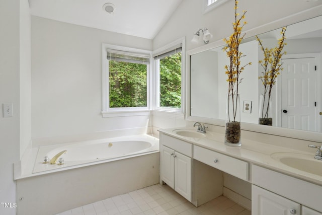 5809 N Hawthorne Way, Raleigh, NC 27603 - full bathroom featuring double vanity, a bath, vaulted ceiling, and tile patterned floors
