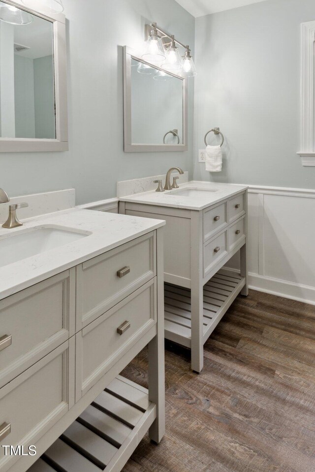 5809 N Hawthorne Way, Raleigh, NC 27603 - bathroom with two vanities and wood finished floors