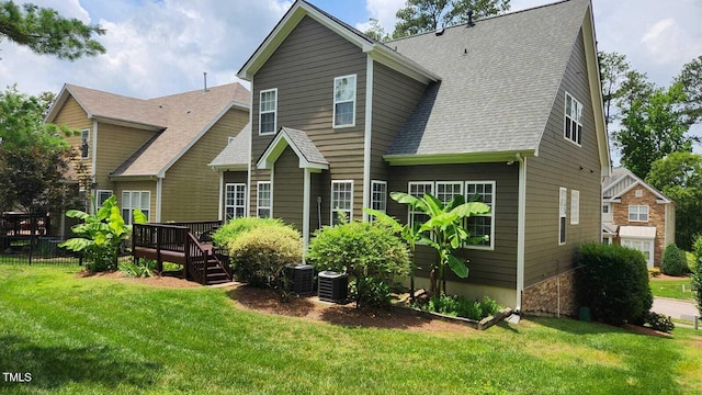 1016 Dotson Way, Apex, NC 27523 - back of house featuring a deck, a lawn, and a shingled roof