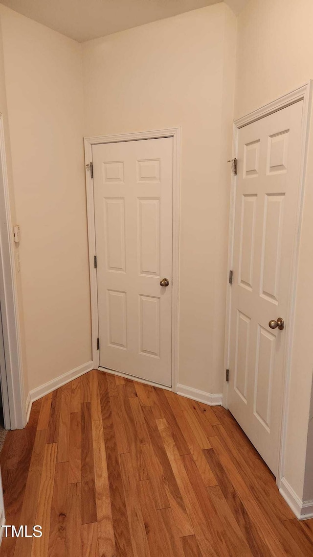 1016 Dotson Way, Apex, NC 27523 - corridor with light wood-type flooring and baseboards