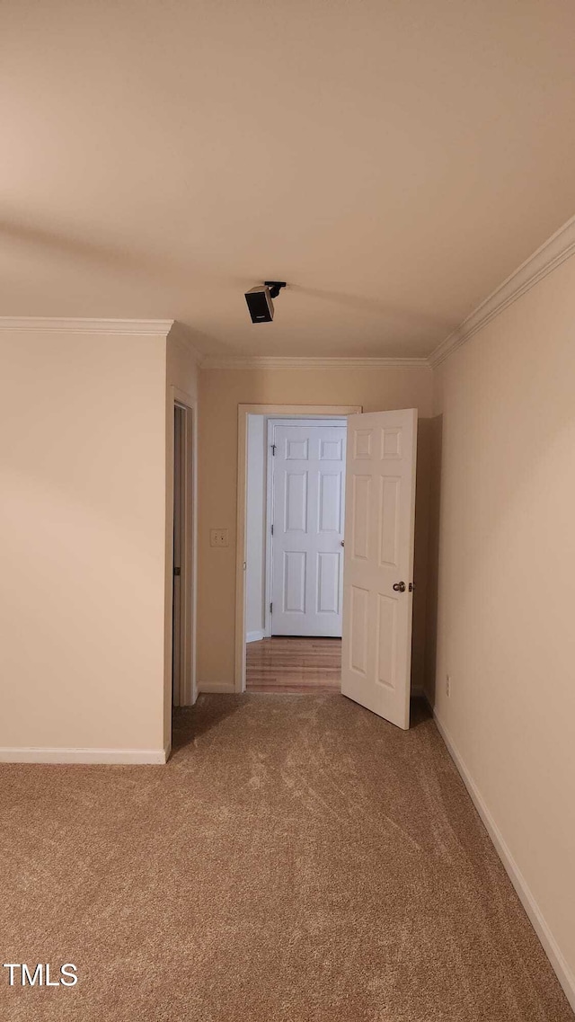 1016 Dotson Way, Apex, NC 27523 - spare room featuring carpet flooring and crown molding