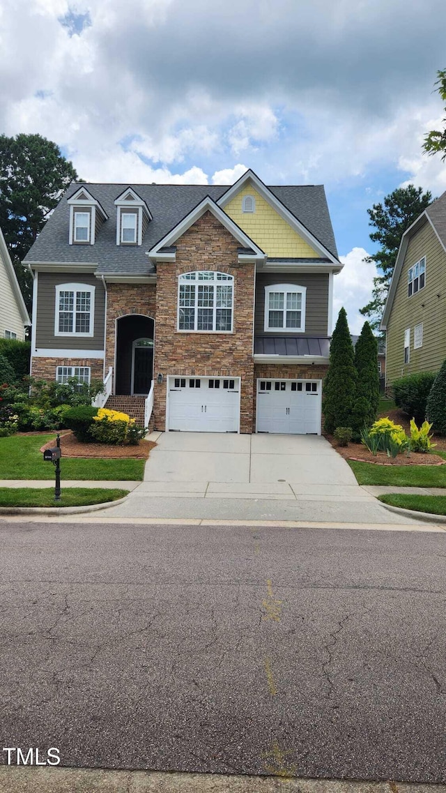 1016 Dotson Way, Apex, NC 27523 - view of front of property featuring a garage, concrete driveway, and stone siding