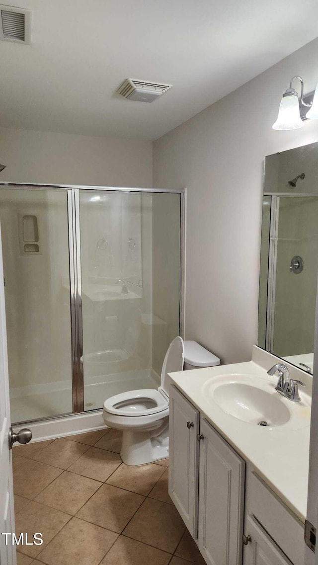 1016 Dotson Way, Apex, NC 27523 - full bath featuring vanity, a stall shower, and tile patterned flooring