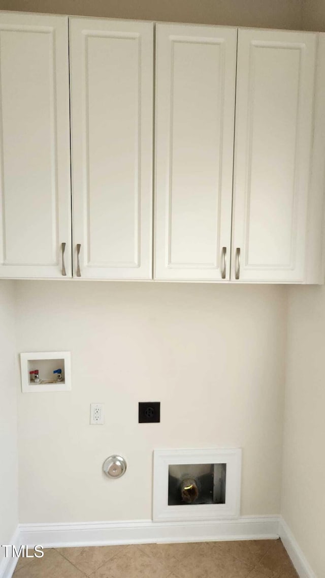 1016 Dotson Way, Apex, NC 27523 - washroom featuring hookup for an electric dryer, washer hookup, cabinet space, and tile patterned floors