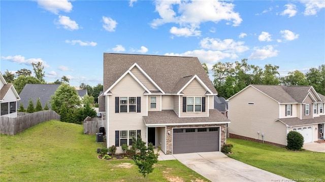 5135 Paul Peel Pl, Hope Mills, NC 28348 - view of front facade featuring concrete driveway, an attached garage, stone siding, and a shingled roof