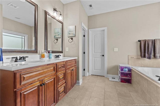 5135 Paul Peel Pl, Hope Mills, NC 28348 - bathroom featuring double vanity, a garden tub, and tile patterned floors