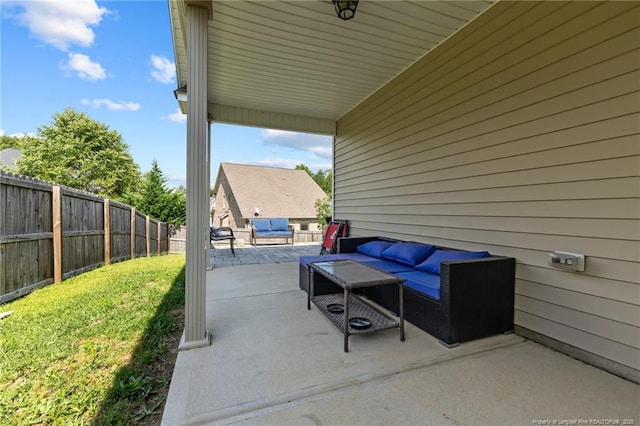 5135 Paul Peel Pl, Hope Mills, NC 28348 - fenced backyard with outdoor lounge area and a patio area