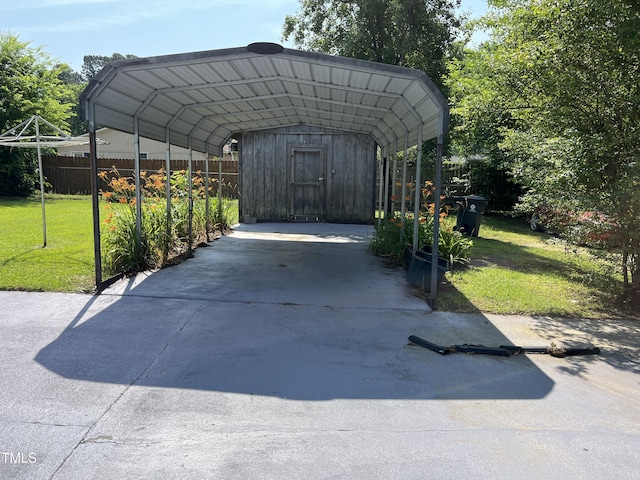 129 S Bullock St, Henderson, NC 27536 - view of car parking featuring a detached carport and concrete driveway