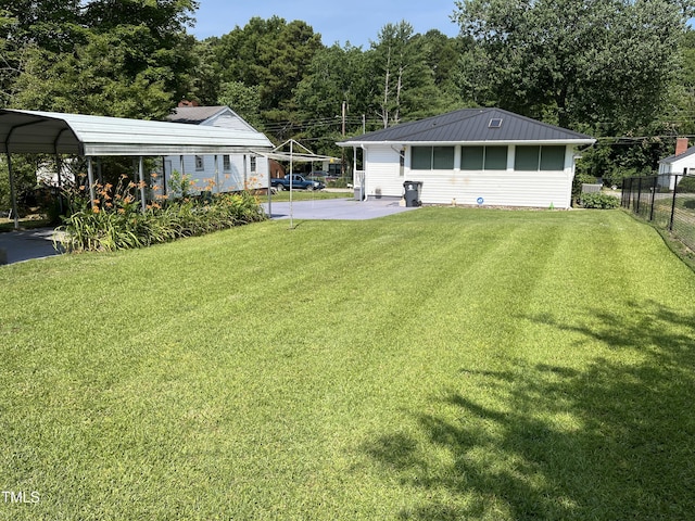 129 S Bullock St, Henderson, NC 27536 - view of yard with a carport