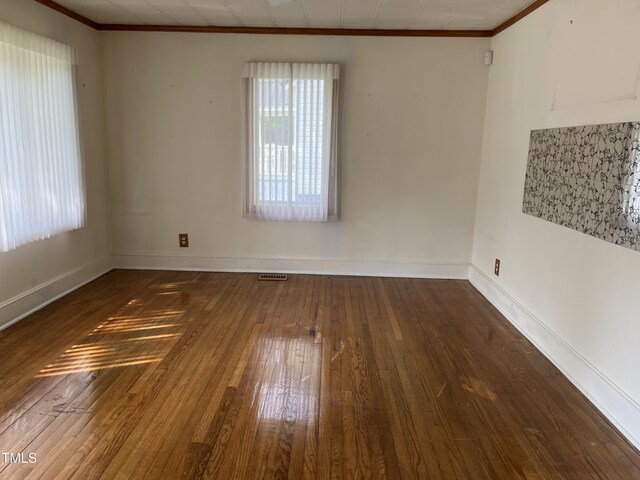129 S Bullock St, Henderson, NC 27536 - unfurnished room with ornamental molding and hardwood / wood-style floors
