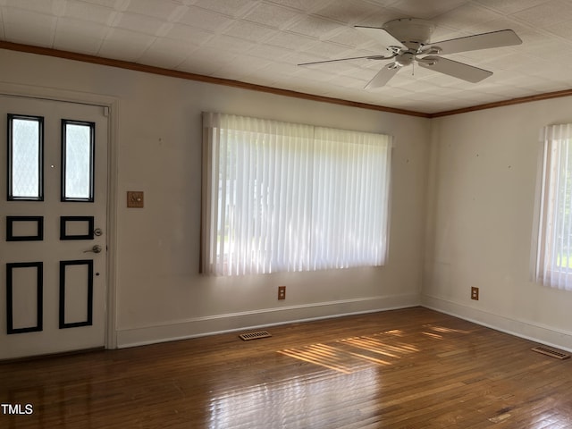 129 S Bullock St, Henderson, NC 27536 - entrance foyer with plenty of natural light, crown molding, ceiling fan, and hardwood / wood-style flooring