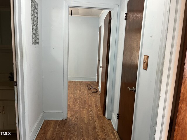 129 S Bullock St, Henderson, NC 27536 - hallway with attic access and wood finished floors