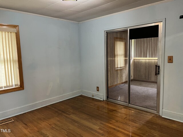 129 S Bullock St, Henderson, NC 27536 - spare room with crown molding and wood finished floors