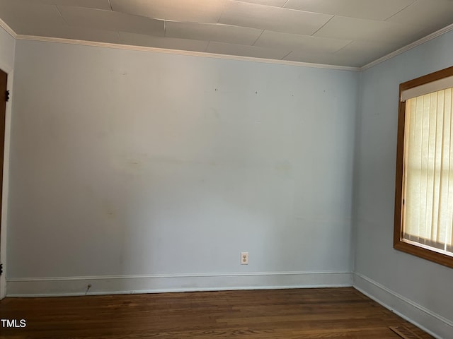 129 S Bullock St, Henderson, NC 27536 - spare room featuring wood finished floors and crown molding