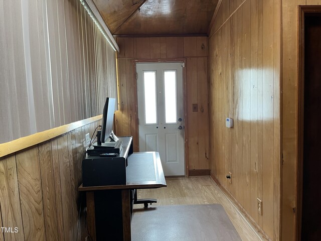 129 S Bullock St, Henderson, NC 27536 - home office with wood walls and light wood-style floors