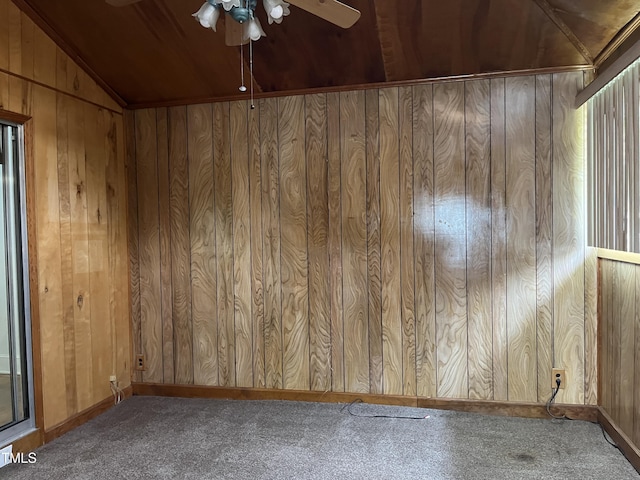 129 S Bullock St, Henderson, NC 27536 - unfurnished room with carpet floors, a ceiling fan, wood walls, and vaulted ceiling