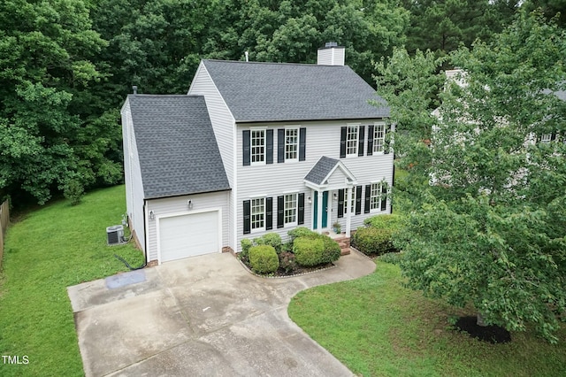 3110 Trinness Dr, Durham, NC 27707 - colonial inspired home with a shingled roof, a chimney, an attached garage, a front yard, and driveway