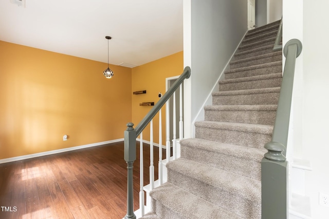 3110 Trinness Dr, Durham, NC 27707 - stairs featuring wood-type flooring and baseboards