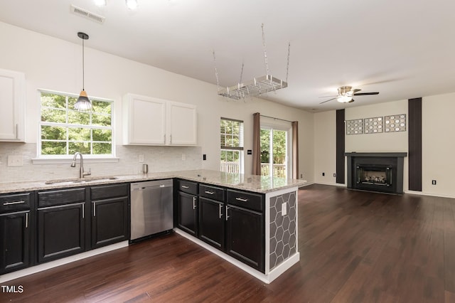 3110 Trinness Dr, Durham, NC 27707 - kitchen featuring dishwasher, white cabinetry, a peninsula, and dark cabinets
