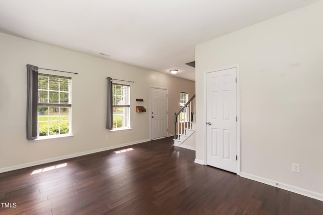 3110 Trinness Dr, Durham, NC 27707 - foyer entrance with stairway and dark wood-style flooring
