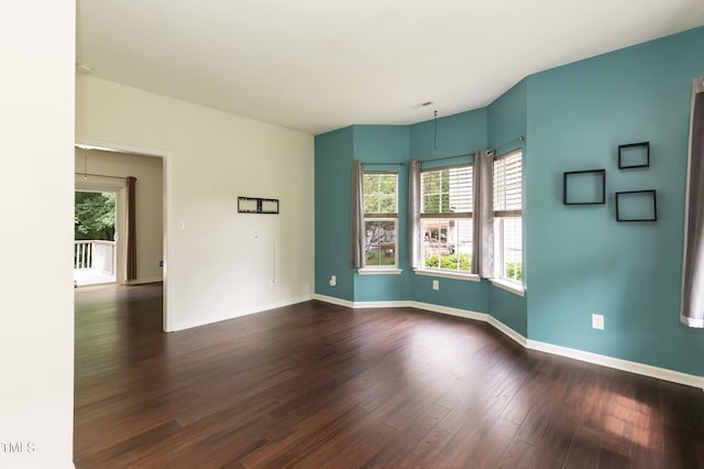 3110 Trinness Dr, Durham, NC 27707 - empty room featuring dark wood-style floors and baseboards