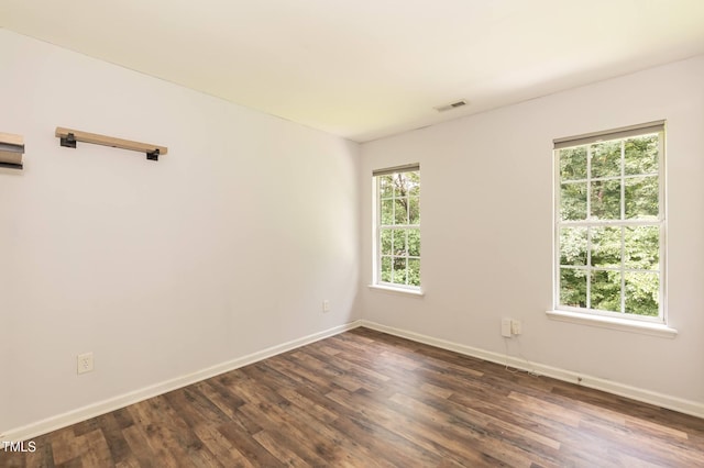 3110 Trinness Dr, Durham, NC 27707 - empty room with baseboards and dark wood-type flooring