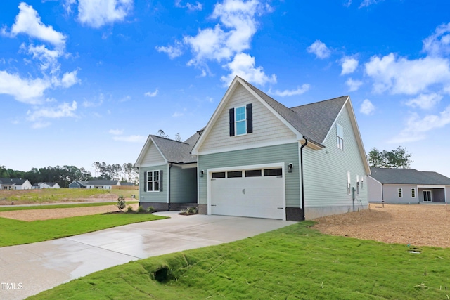 222 Cherrybirch Ln, Zebulon, NC 27597 - traditional-style house with driveway, an attached garage, a front lawn, and roof with shingles