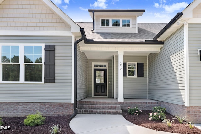 222 Cherrybirch Ln, Zebulon, NC 27597 - property entrance featuring covered porch and roof with shingles