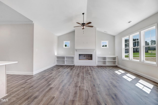 222 Cherrybirch Ln, Zebulon, NC 27597 - unfurnished living room with a ceiling fan, a fireplace, wood finished floors, plenty of natural light, and vaulted ceiling