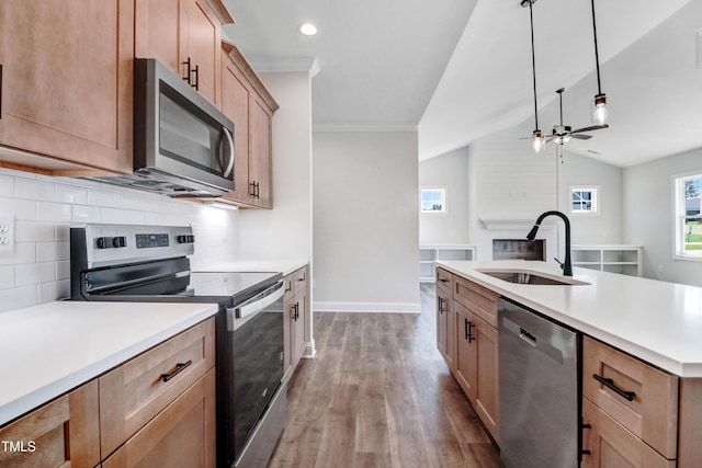 222 Cherrybirch Ln, Zebulon, NC 27597 - kitchen featuring appliances with stainless steel finishes, wood finished floors, decorative backsplash, light countertops, and recessed lighting