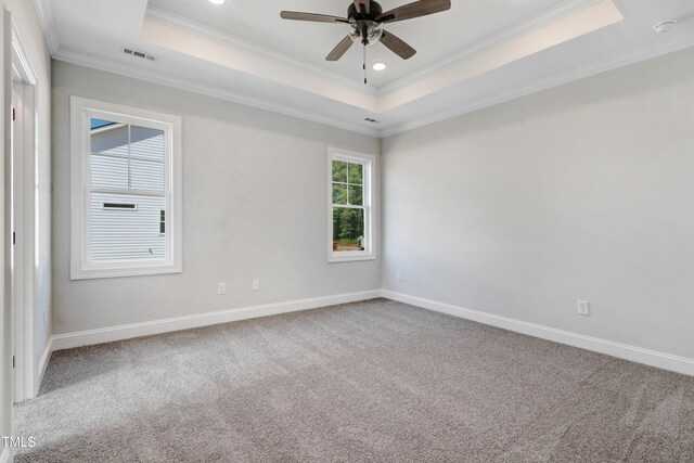 222 Cherrybirch Ln, Zebulon, NC 27597 - carpeted spare room with a tray ceiling, ornamental molding, ceiling fan, a smoke detector, and recessed lighting