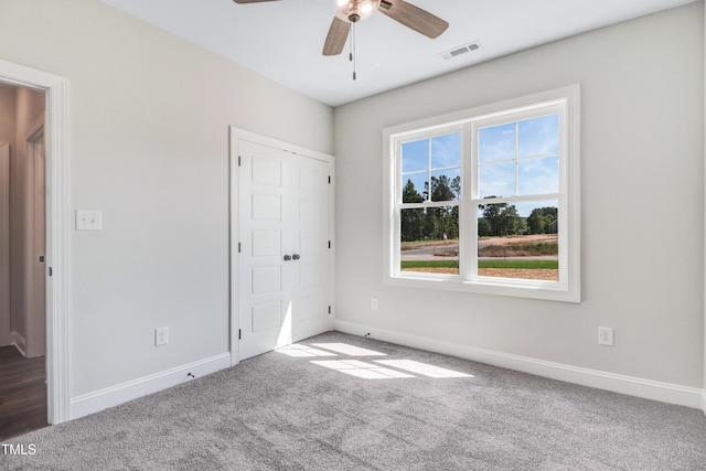 222 Cherrybirch Ln, Zebulon, NC 27597 - unfurnished bedroom with carpet, a closet, and ceiling fan