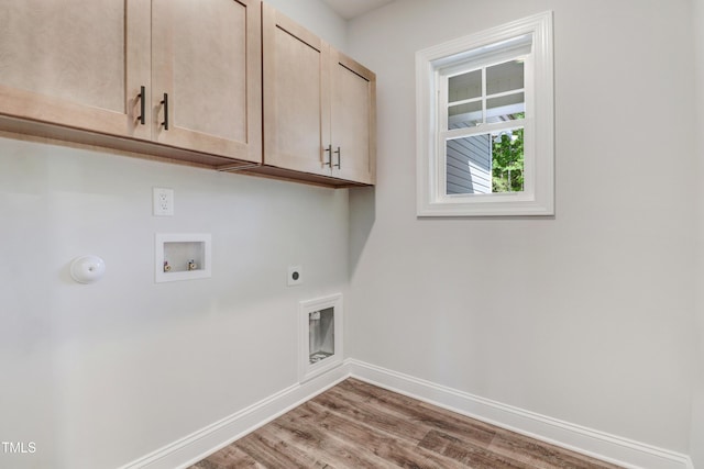222 Cherrybirch Ln, Zebulon, NC 27597 - laundry area with cabinet space, hookup for a washing machine, electric dryer hookup, wood finished floors, and gas dryer hookup