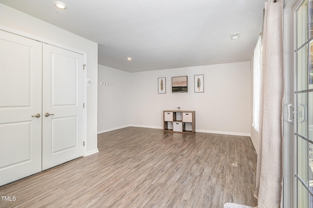 248 Amber Acorn Ave, Raleigh, NC 27603 - unfurnished living room featuring wood finished floors and recessed lighting