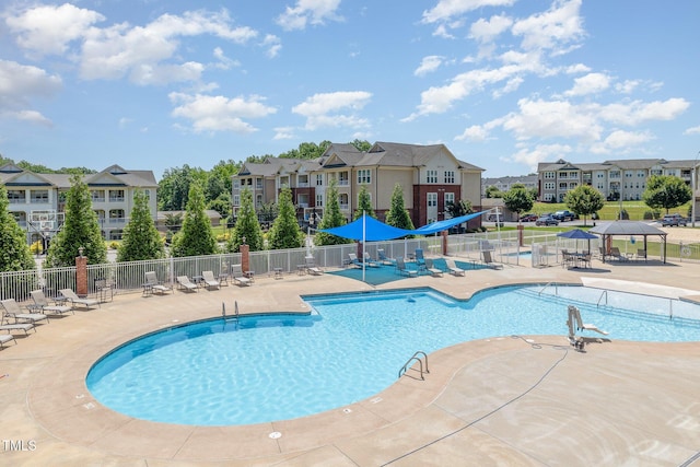 248 Amber Acorn Ave, Raleigh, NC 27603 - community pool featuring a patio and a residential view