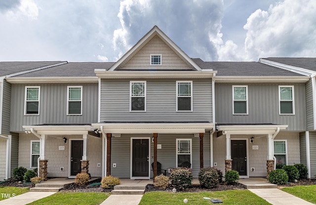 121 Longleaf Pine St, Clayton, NC 27527 - multi unit property featuring covered porch, a front yard, and roof with shingles