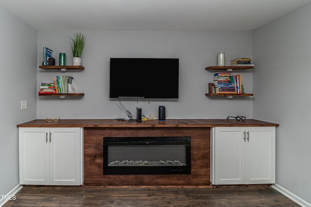 121 Longleaf Pine St, Clayton, NC 27527 - living room featuring dark wood-style flooring and a glass covered fireplace