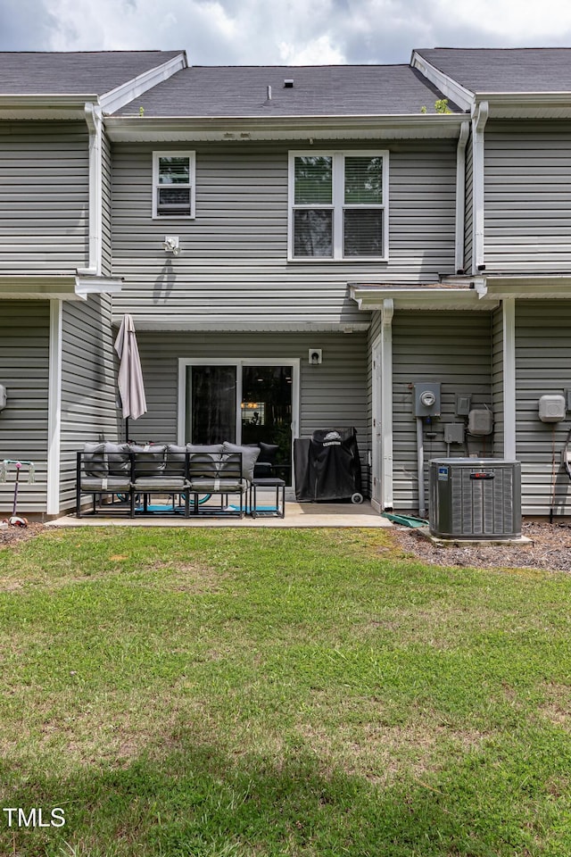 121 Longleaf Pine St, Clayton, NC 27527 - back of property with an outdoor hangout area, a patio, and a lawn