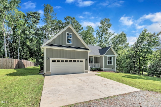 3909 Bristlewood Dr, Durham, NC 27703 - view of front of property featuring concrete driveway, a garage, crawl space, and covered porch