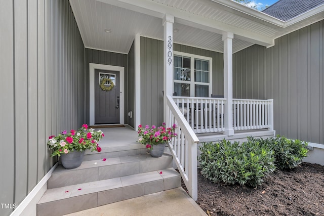 3909 Bristlewood Dr, Durham, NC 27703 - doorway to property with covered porch and a shingled roof