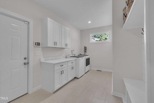 3909 Bristlewood Dr, Durham, NC 27703 - laundry area with cabinet space, washer and dryer, and recessed lighting