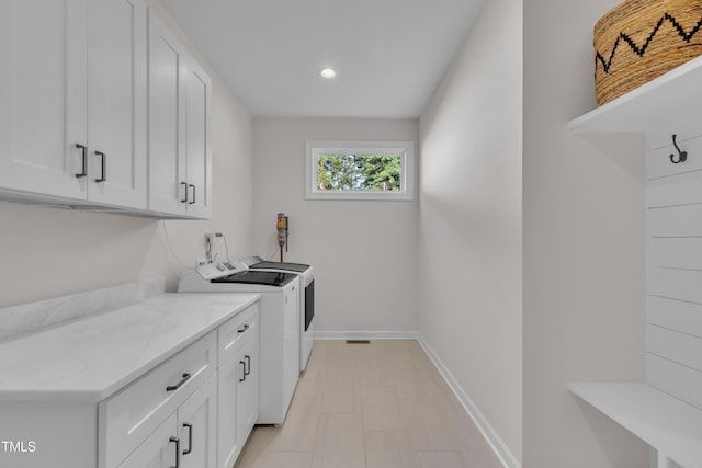 3909 Bristlewood Dr, Durham, NC 27703 - laundry area with washer and clothes dryer, cabinet space, and recessed lighting