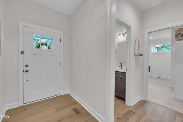 3909 Bristlewood Dr, Durham, NC 27703 - foyer with light wood-style floors and plenty of natural light