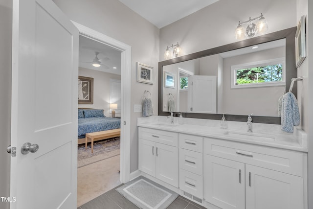 3909 Bristlewood Dr, Durham, NC 27703 - full bath featuring double vanity, connected bathroom, and a ceiling fan
