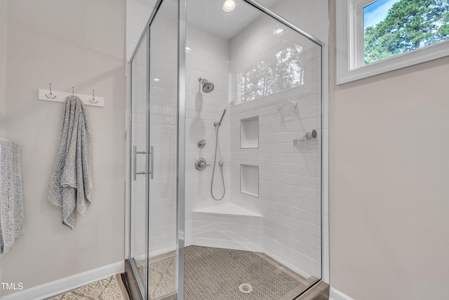 3909 Bristlewood Dr, Durham, NC 27703 - full bathroom with a shower stall and baseboards