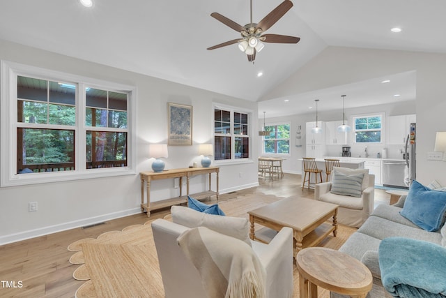 3909 Bristlewood Dr, Durham, NC 27703 - living room with a ceiling fan, recessed lighting, light wood-style flooring, and high vaulted ceiling