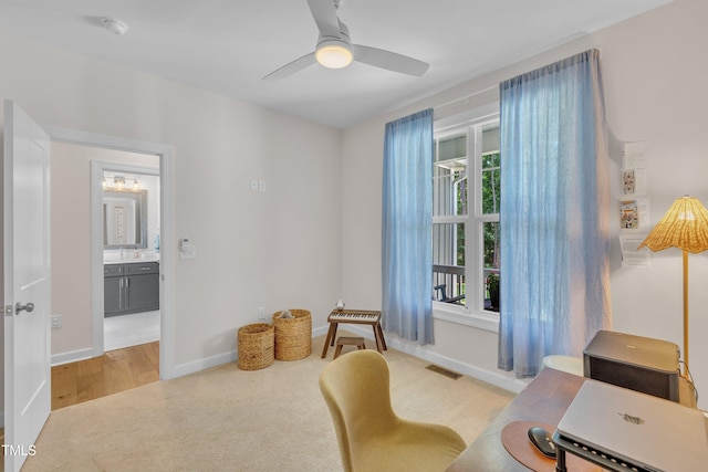 3909 Bristlewood Dr, Durham, NC 27703 - sitting room with light colored carpet, a ceiling fan, and a desk